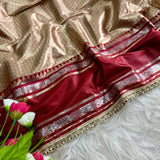 Launching this rich golden-beige and maroon silk saree
