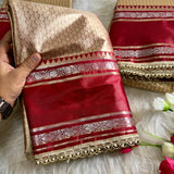 Launching this rich golden-beige and maroon silk saree