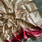 Launching this rich golden-beige and maroon silk saree